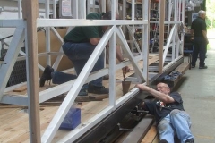 Later on, Charles is taking a rest while Mark holds the screw from turning.