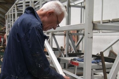 … and Phil carries on, priming the new seat supports in carriage No. 23.