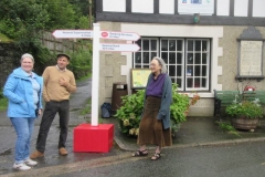 A photo of the sign in front of the Institute would not be complete without the presence of Jan, Postmistress.