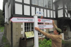 Tuesday, 22.8.2023. The Post Office have arrived in Corris the day after the Government tells us that in rural areas we will have access to a bank within 3 miles to extol the current virtues of the Post Office - but the sign is drooping!