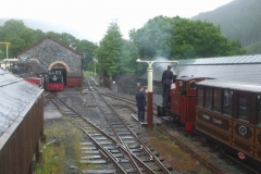 ... where No. 7 is watered by Tom and Ben as No. 11 is brought out of the Engine Shed to receive a little servicing.