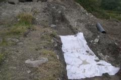 … so that the initial section of geotextile can be rolled out …