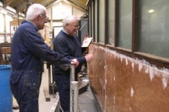 Graham continues filling screw holes, etc., around carriage No. 20’s new panels …