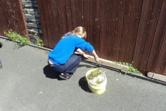 Kate gets down to some weeding...