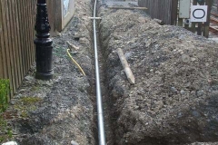 By the end of the day, the bulk of the pipes have been laid in the trench.