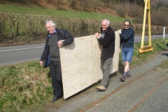 Saturday, 25.03.17. Early volunteers Phil and Peter, assist Tony in moving a sheet of shuttering ply down to the Carriage Shed.