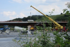 Southern Extension. New Dyfi Bridge Scheme. Thursday, 15.6.2023. Parapet sections are craned into position and attached to the bridge deck, working progressively southwards along the viaduct. They had all been completed by the end of the month.