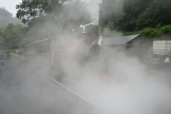 The first train heads north from Maespoeth, the sultry atmosphere making the steam more visible than normal.