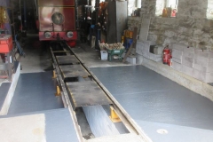 Tuesday, 20.6.2023. The threat of rain inspired the painting of the new floors in the Engine Shed before they became too contaminated with oil.