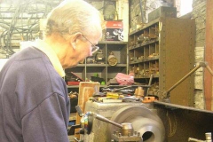 Chris is gently facing the first of the axlebox castings for carriage Nos. 23 & 24.
