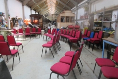 After clearing space (by moving machinery, rolling stock and benches out of the way) the chairs are set out all ready for the next day.