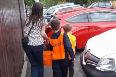 Jane helps a couple of young tracksiders with a bucket of water.