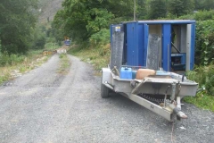 ... enabling the blue lorry not stuck under the railway bridge in Machynlleth, to tip more material ...