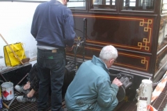 … as opposite, Steve, Chris and Bob progressively remove buffers from carriage Nos. 21 & 22 to re-grease them.