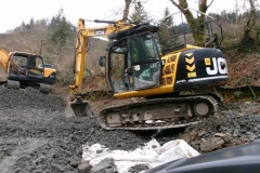 ... and the other excavator eased across ...