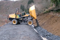 ... which dumper (after cleaning out by hand) is used to bring down and deposit fresh drainage material.