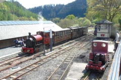 The passenger train waits in Maespoeth South platform, while the loco crew enjoy the sunshine.