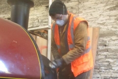 ... and Jack, not tired after mixing concrete for much of the day, finishes off by cleaning up the paintwork on No. 7's smokebox.