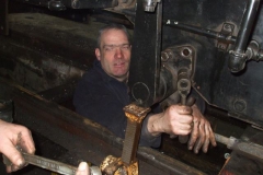 … while under the loco, Trefor is removing various items …