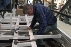 … before setting-to, extending holes for brake pipework in carriage No. 23’s frames …