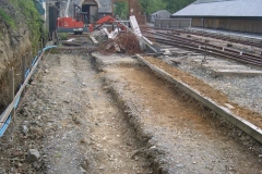 Outside, the initial shuttering for the new retaining wall is set out and some of the foundation trimmed.