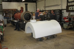 Andy discusses the fabrication of the saddle tank with a member of Keef's staff